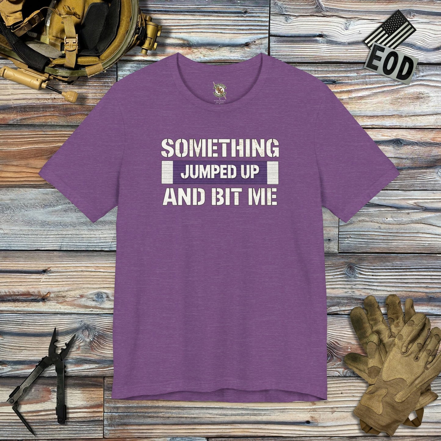 K-Factor Supply Co Something Bit Me T-Shirt Heather Team Purple / S